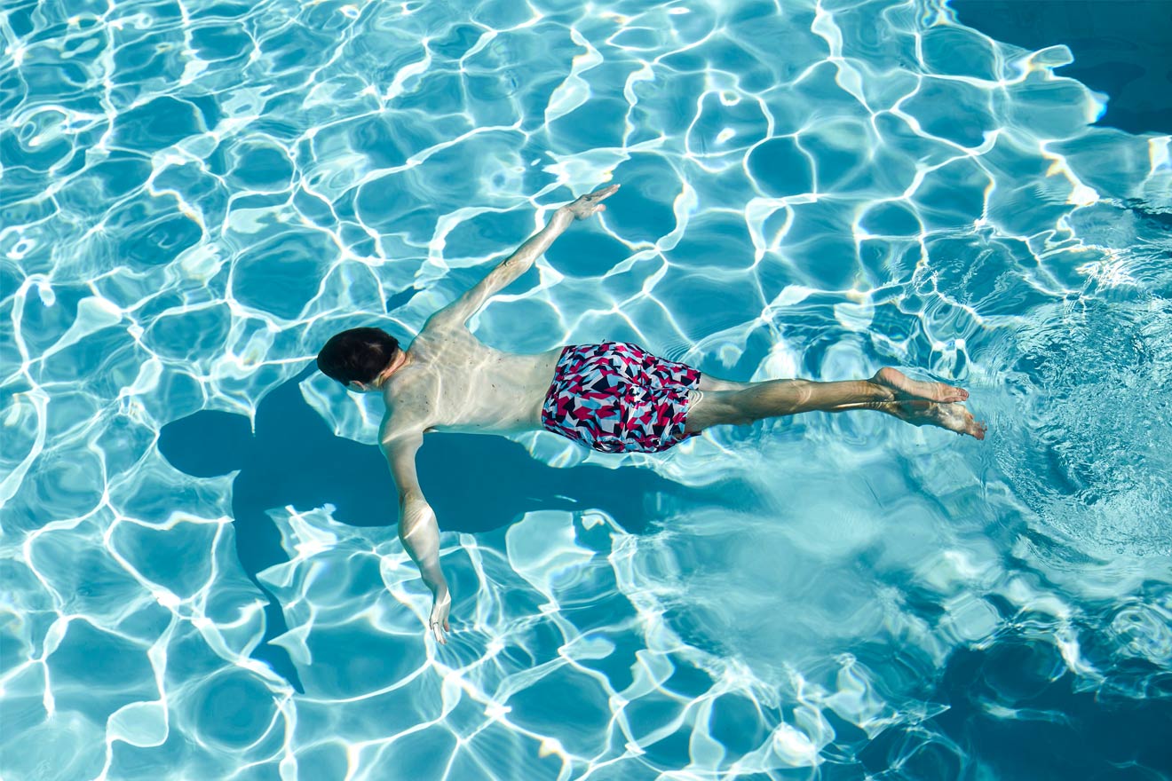 man swimming in the pool