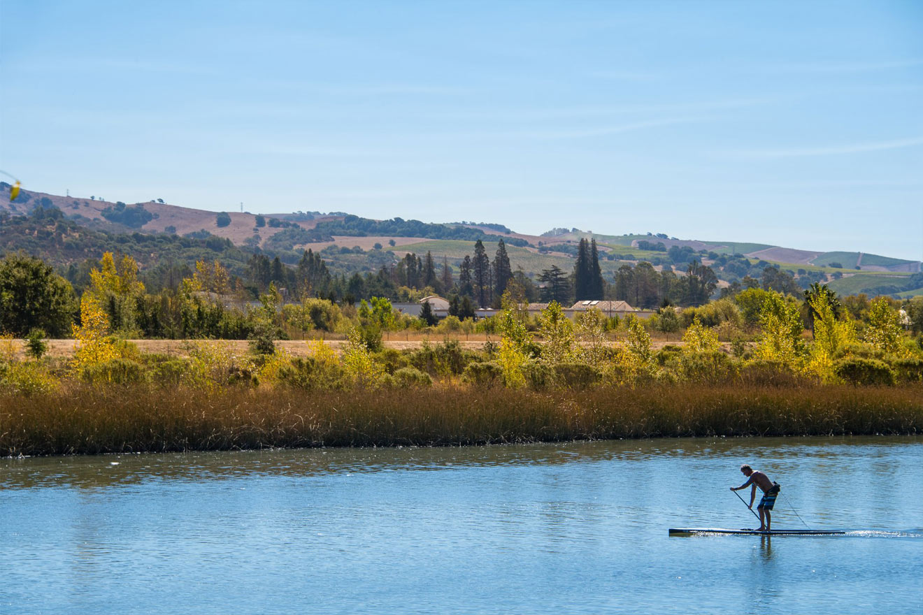Paddle boarding on the river. Bob McClenahan Photography
